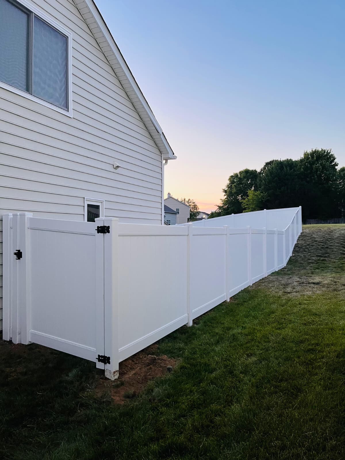 White Vinyl Privacy Fence for a private neighborhoods.